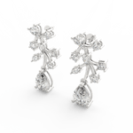 Angled view of white gold floral earrings with lab grown diamonds arranged symmetrically on polished petals.
