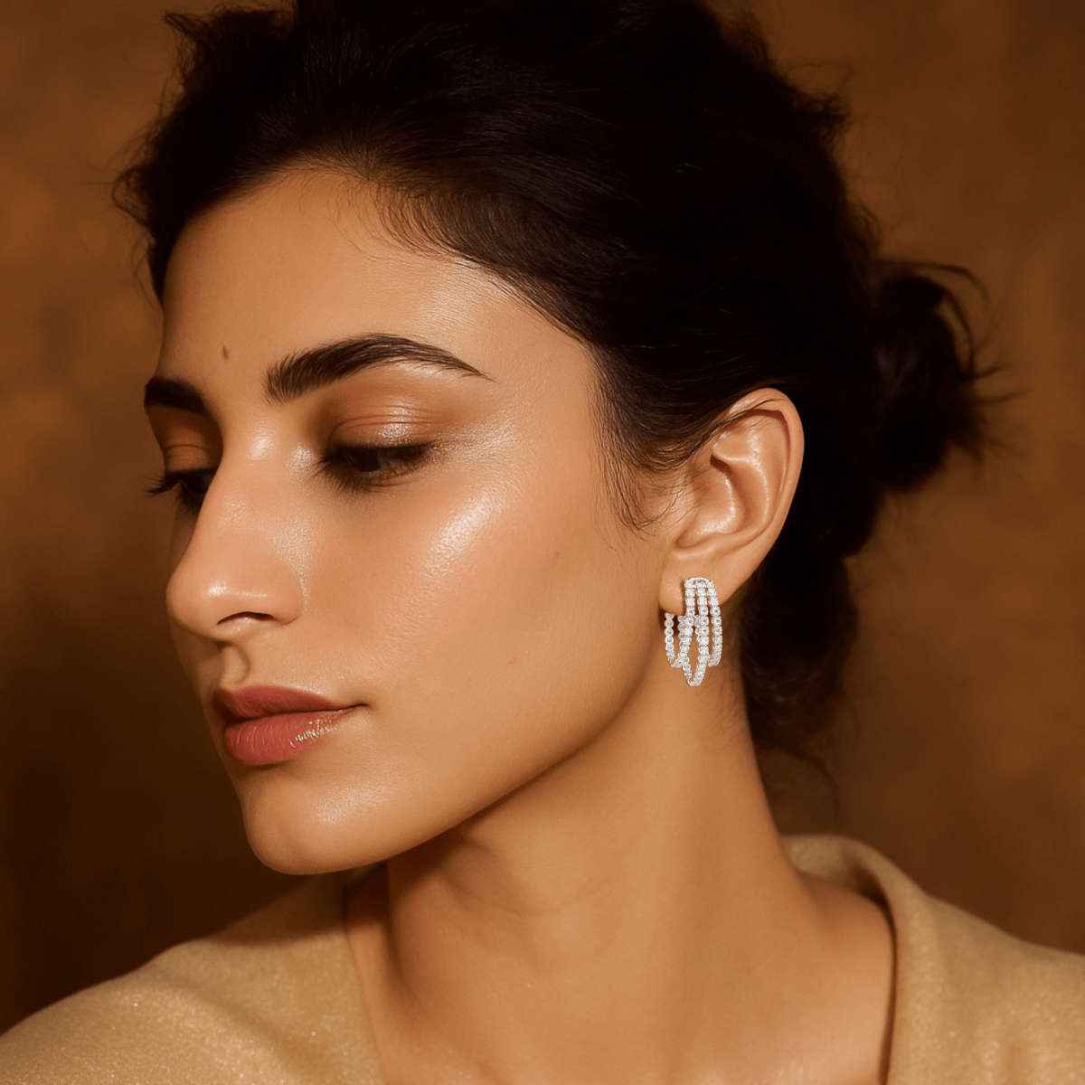Model wearing Aurora white gold triple hoop diamond earrings styled for modern brilliance and layered elegance.

