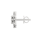 Side profile showing white gold petal-inspired earrings with push-back clasp and clean lines.
