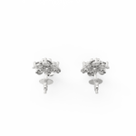 Top-down image of white gold earrings with blooming edges and center solitaire diamond.
