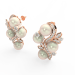 Angled view of rose gold pearl bloom earrings featuring elegant floral shape with lab grown diamonds and pearl.
