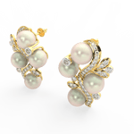 Angled view of yellow gold pearl bloom earrings showcasing lab grown diamonds arranged around the central pearl.
