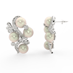 Side profile of white gold earrings with secure push-back clasp and elegant pearl and diamond setting.
