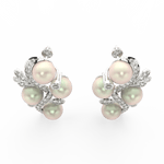 Top view highlighting white gold floral arrangement with central pearl and lab grown diamond petals.
