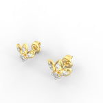 Angled view of round yellow gold earrings with SGL certified lab grown diamonds.
