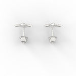 Top view of polished white gold studs featuring round SGL certified diamonds.

