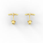 Overhead view of yellow gold lab grown diamond earrings in classic stud style.

