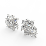 Angled view of white gold Elira ring showcasing pear and oval lab grown solitaires with polished finish.
