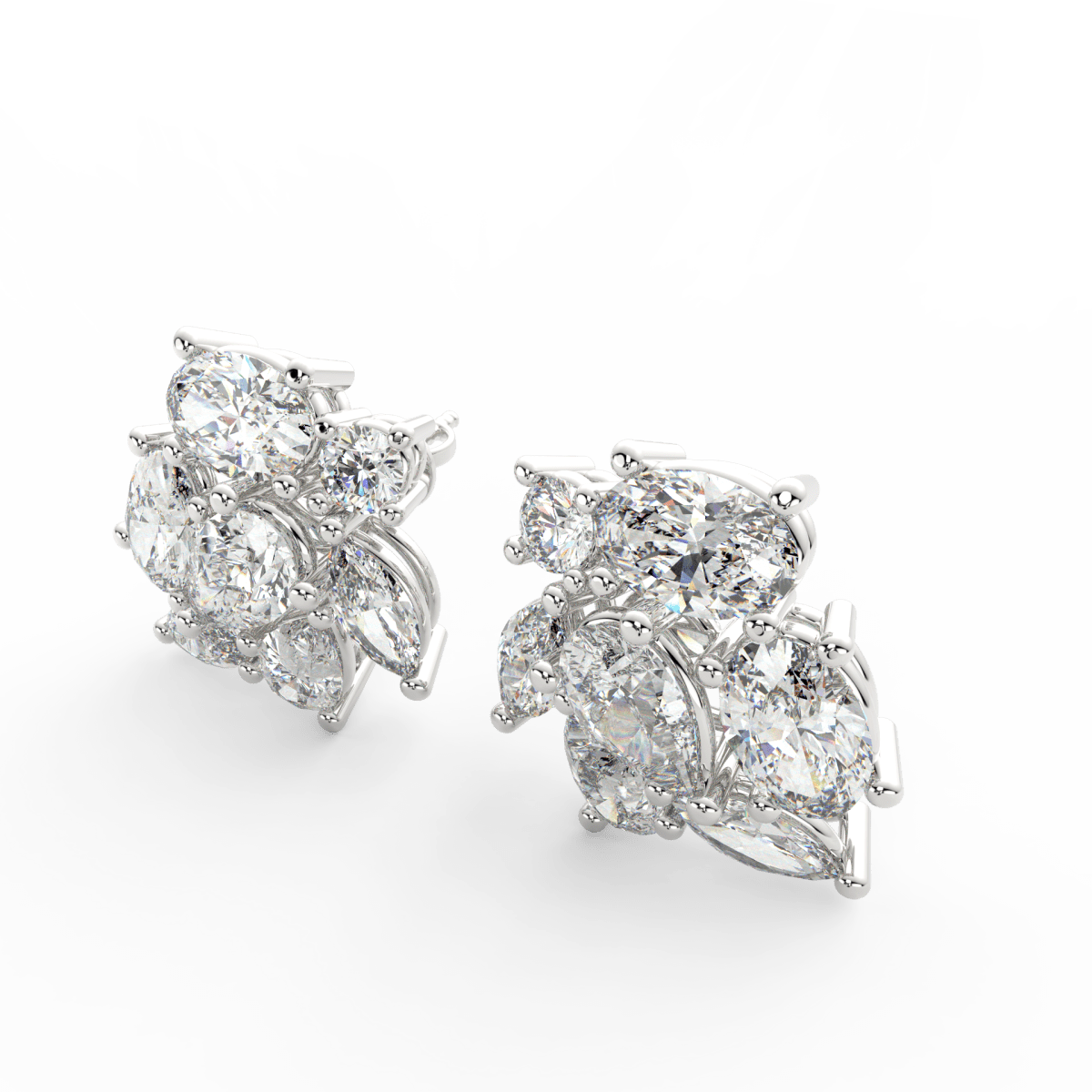 Angled view of white gold Elira ring showcasing pear and oval lab grown solitaires with polished finish.
