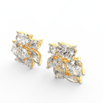 Angled view of yellow gold Elira ring with pear and oval-shaped lab grown diamonds showcasing brilliant contrast.

