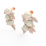 Angled view of rose gold floral pearl earrings with polished finish and sparkling lab grown diamond petals.
