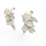 Angled view of white gold floral pearl earrings featuring polished surface and sparkling lab grown diamonds.

