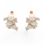 Top view highlighting rose gold floral structure with pearl center and lab grown diamond accents.
