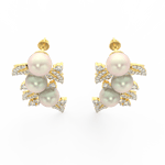 Top view showing yellow gold floral design with pearl center surrounded by lab grown diamond petals.
