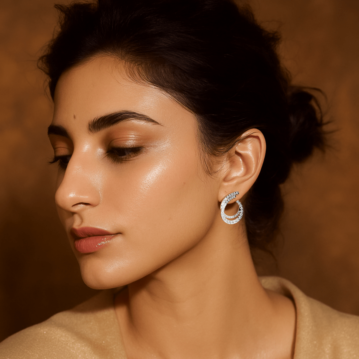 Model styled in white gold Elysia twist diamond earrings for timeless movement and subtle glamour.

