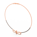 Angled view of rose gold mangalsutra featuring lab grown diamond infinity motif and delicate beaded chain.
