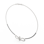 Side profile of white gold infinity mangalsutra featuring curved silhouette, lab grown diamonds, and secure clasp.
