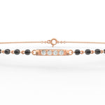 Top view of rose gold Eternal Noir mangalsutra bracelet highlighting diamond arrangement with polished beaded chain.
