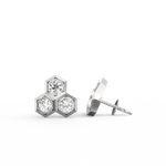 Side profile of white gold earrings with secure push-back clasp and polished round edge.
