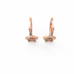 Top view of rose gold earrings with soft curved silhouette and shimmering lab grown diamonds.
