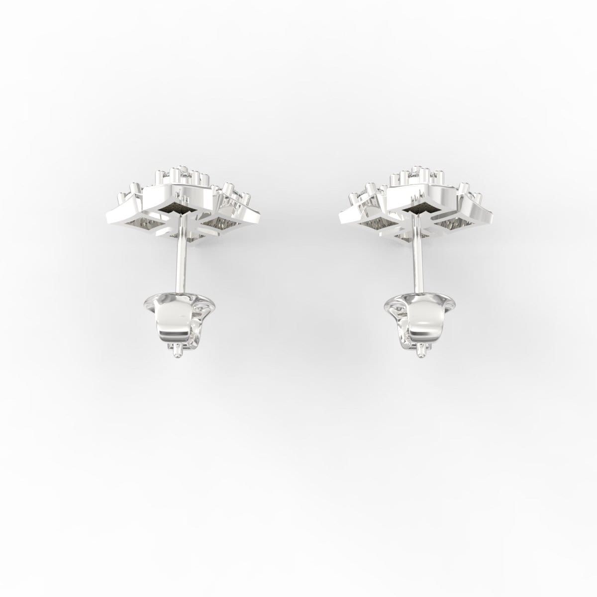 Overhead view of minimalist white gold studs with gleaming lab grown diamonds at the center.

