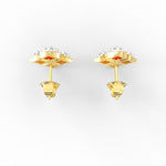 Top view of yellow gold diamond studs designed with precision and ethical craftsmanship.

