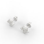 Close-up angled view of lab grown diamond earrings in white gold bezel setting.
