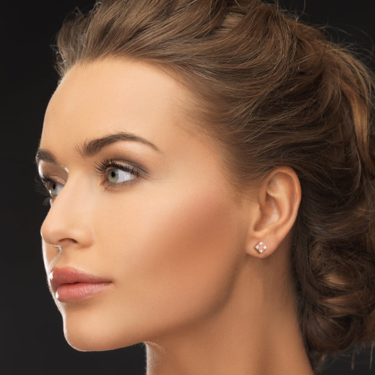 
Indian model wearing dainty rose gold lab grown diamond earrings styled for casual elegance.
