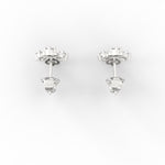 Top-down view of petite round white gold diamond studs made with SGL certified stones.


