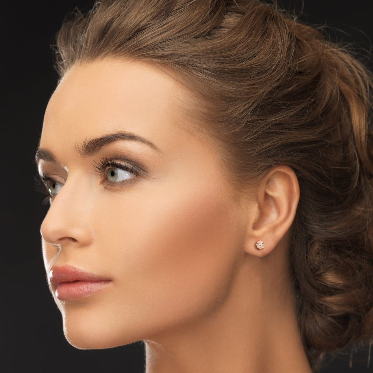 Model styled with rose gold Graceful Whispers earrings for a subtle and sophisticated finish.

