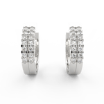 Front view of Lumière white gold oval hoop earrings with lab grown diamonds in sleek channel setting.
