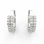 Top view of white gold hoops showcasing lab grown diamonds aligned in polished channel frame.
