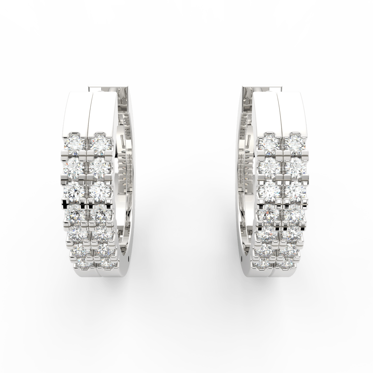 Top view of white gold hoops showcasing lab grown diamonds aligned in polished channel frame.
