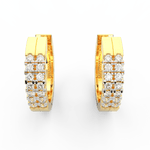 Top view of yellow gold hoop earrings showcasing neatly aligned lab grown diamonds in channel setting.
