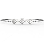 White Gold: Close-up of Obsidian Glamour white gold mangalsutra bracelet with sparkling lab grown diamonds and polished black beads set in white gold links.

