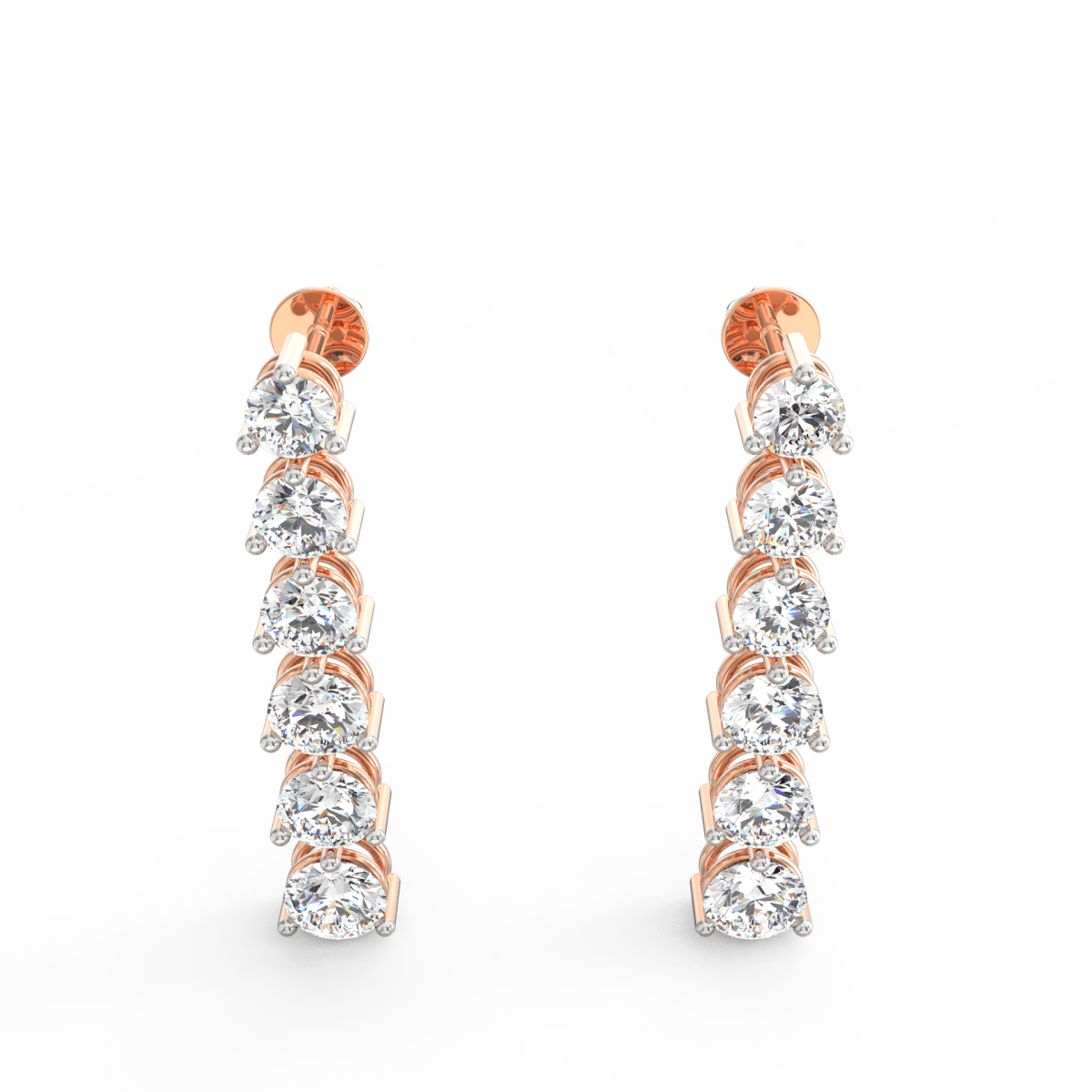 Angled close-up of rose gold drop earrings featuring polished flow and radiant lab grown diamonds.
