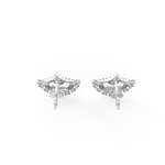 Top view of white gold earrings highlighting precise diamond alignment and polished linear silhouette.
