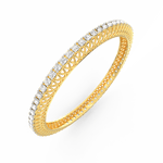 Angled image showing sparkling diamonds on yellow gold bangle.
