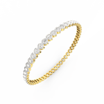 Angled image capturing shimmer of diamonds on yellow gold.
