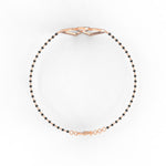 Seen from the side, this rose gold bangle shows off its sleek contours.
