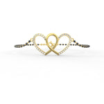 Close-up of the sustainable diamond accents on this yellow gold bangle, top perspective.
