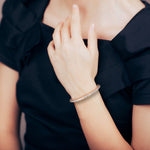  Model wearing the Radiant Allure bangle in rose gold, highlighting its elegant fit and sparkle.