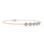 Side profile highlighting the minimalist chain structure and soft rose tone.
