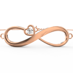 Top view of rose gold bracelet featuring infinity curves set with tiny shimmering diamonds.

