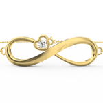 Top view of the bracelet’s full arc highlighting the infinity loop and diamonds on yellow gold.

