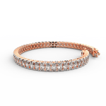 Side view showing slim profile and diamond symmetry of rose gold lab bracelet.
